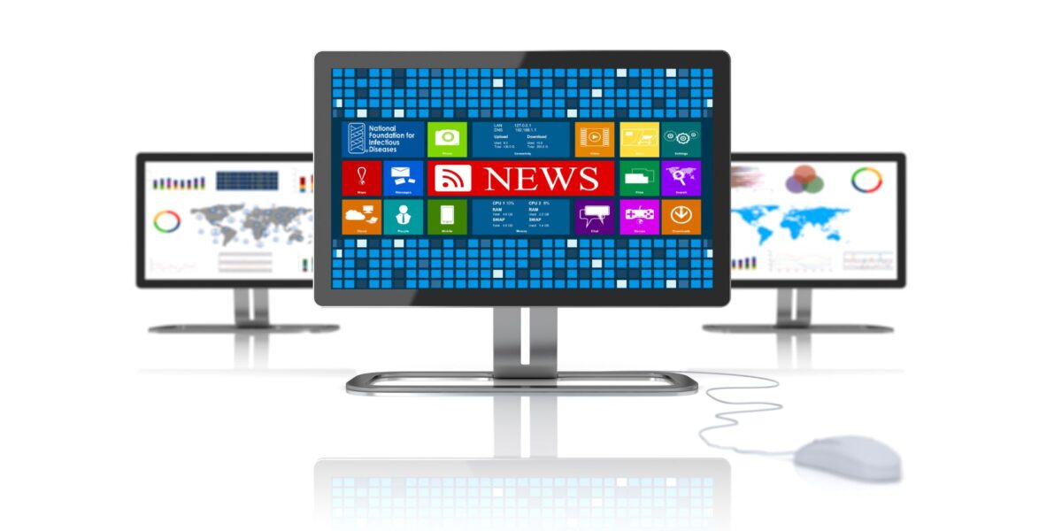A computer monitor with news app icons on it